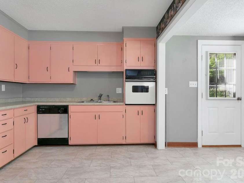 1482 Island Ford Road, Brevard, NC 28712.  MLS# CAR4366891, YatesRealty ID 16887. Dining to Back Yard
