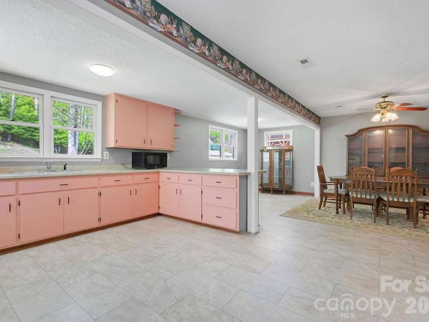 1482 Island Ford Road, Brevard, NC 28712.  MLS# CAR4366891, YatesRealty ID 16887. Open Kitchen and Dining Area