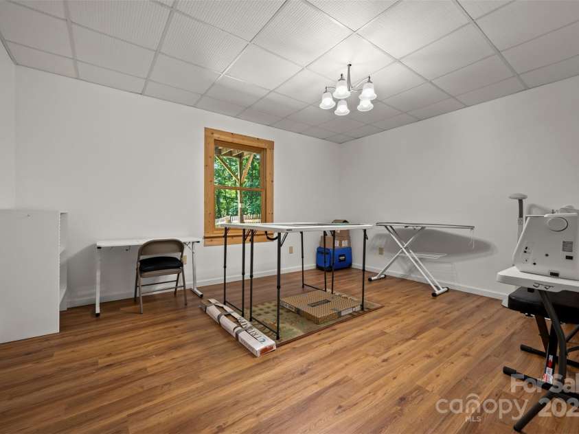 23 Jay Foster Way, Saluda, NC 28773.  MLS# CAR4278065, YatesRealty ID 1689. Flex space in basement used as sewing room (unheated and not contiguous)