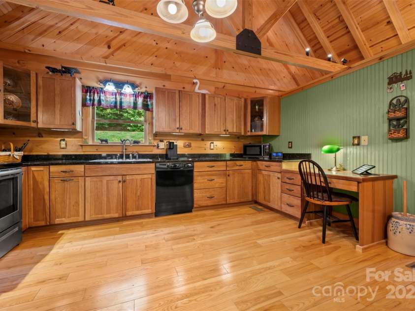 23 Jay Foster Way, Saluda, NC 28773.  MLS# CAR4278065, YatesRealty ID 1689. Kitchen has Granite countertops and abundant cabinets.  All Appliances convey, including microwave!