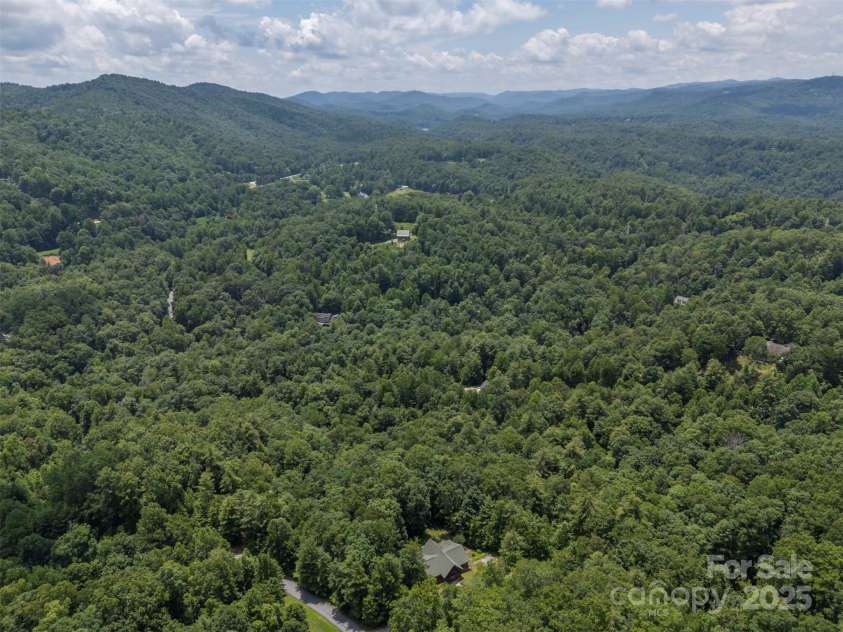 23 Jay Foster Way, Saluda, NC 28773.  MLS# CAR4278065, YatesRealty ID 1689. Lake Summit at top center of photo.