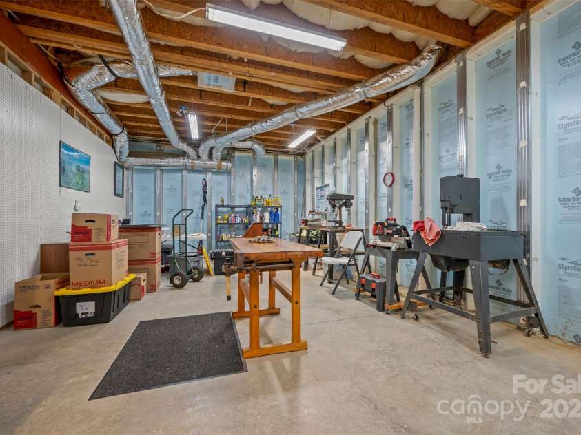 23 Jay Foster Way, Saluda, NC 28773.  MLS# CAR4278065, YatesRealty ID 1689. Large Workshop Area has many uses.