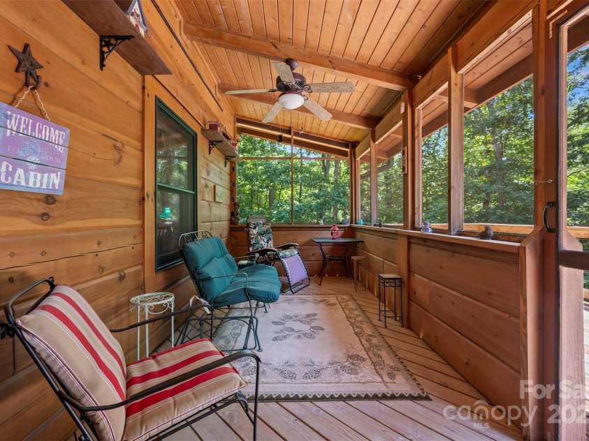 23 Jay Foster Way, Saluda, NC 28773.  MLS# CAR4278065, YatesRealty ID 1689. Lovely screen porch off living room.  Perfect for enjoying your morning coffee or your evening drink of choice!  (ALL ORNAMENTAL SHELVING THROUGHOUT DOES NOT CONVEY AND HAS BEEN REMOVED!)