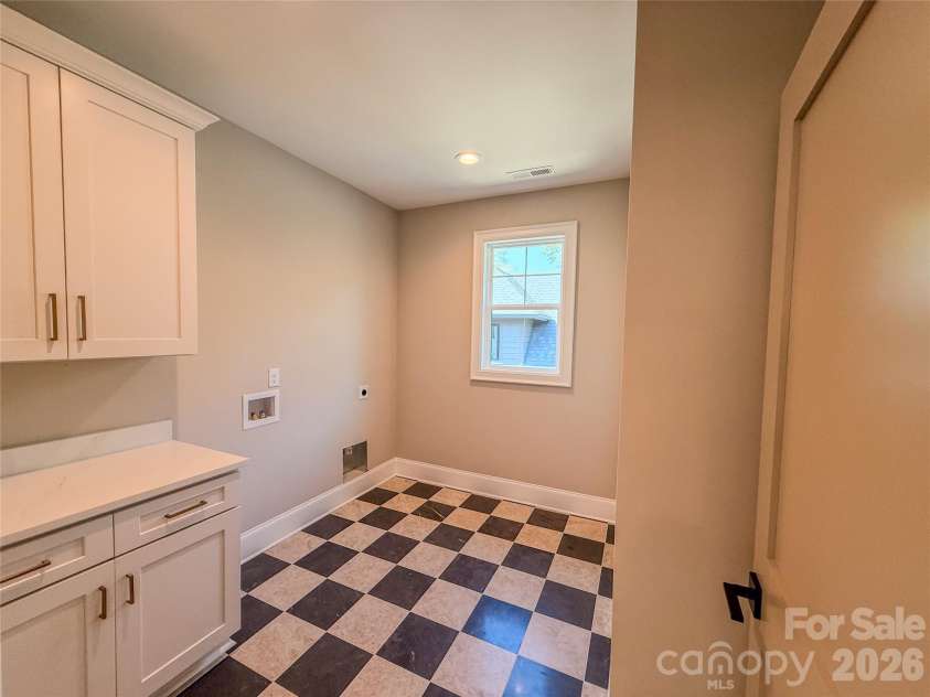 4822 Walker Road, Charlotte, NC 28211.  MLS# CAR4360360, YatesRealty ID 16890. Upper Floor Laundry Room