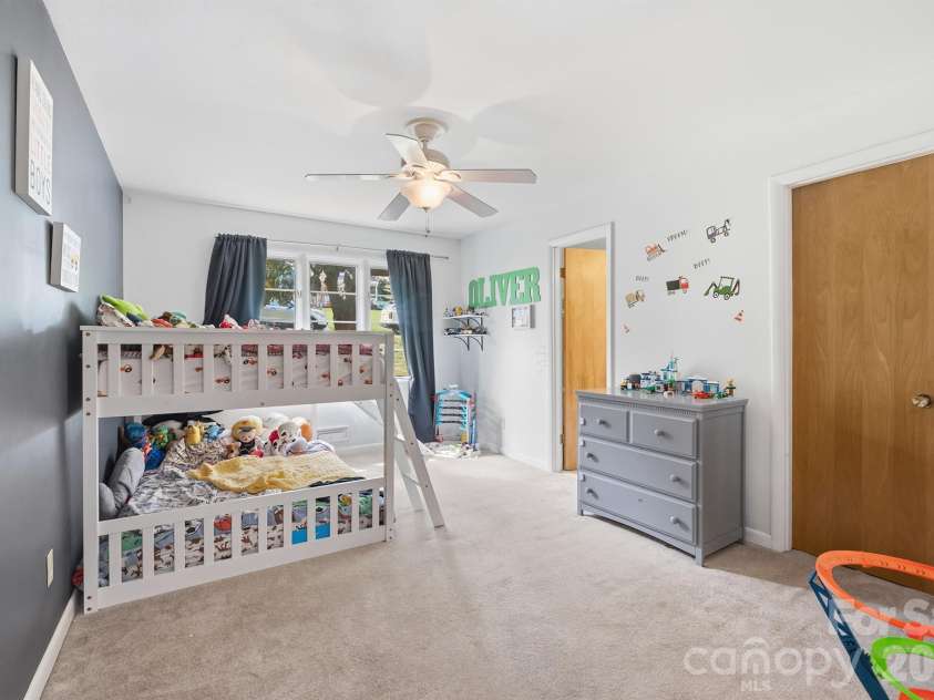 465 28th Avenue Lane, Hickory, NC 28601.  MLS# CAR4365882, YatesRealty ID 16892. Comfortable primary bedroom featuring ample space and peaceful setting
