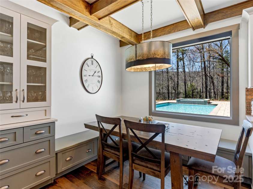 59 Bradford Hill Road, Mills River, NC 28759.  MLS# CAR4241459, YatesRealty ID 16892. Breakfast nook with built-in seating and pool views.