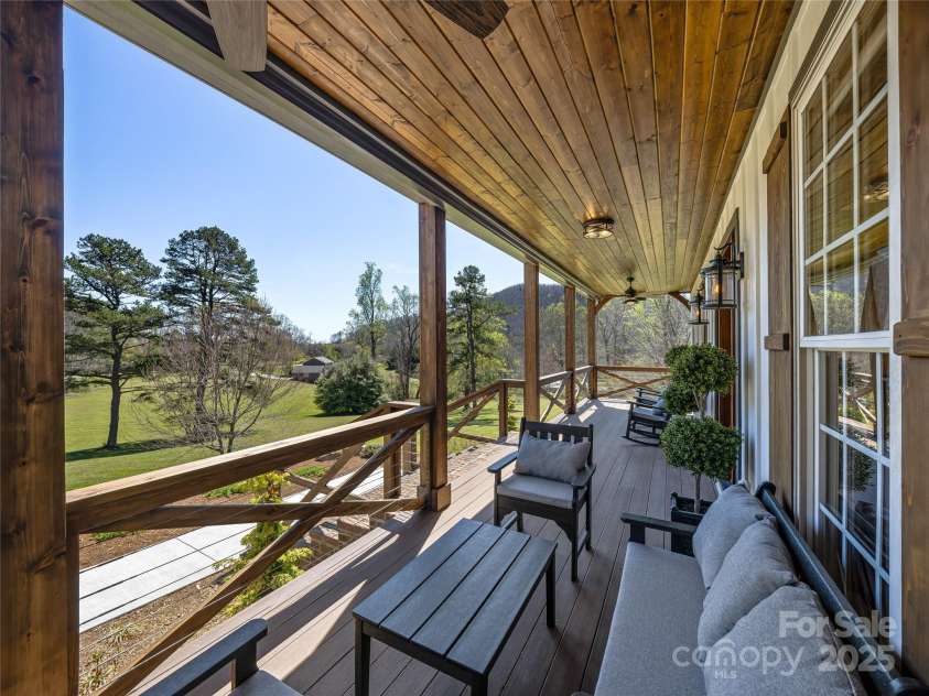 59 Bradford Hill Road, Mills River, NC 28759.  MLS# CAR4241459, YatesRealty ID 16892. Covered front porch grants tranquil views
