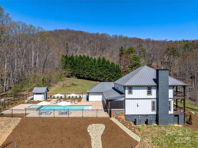 59 Bradford Hill Road, Mills River, NC 28759.  MLS# CAR4241459, YatesRealty ID 16892. Enjoy the pool and mountain views at the same time!