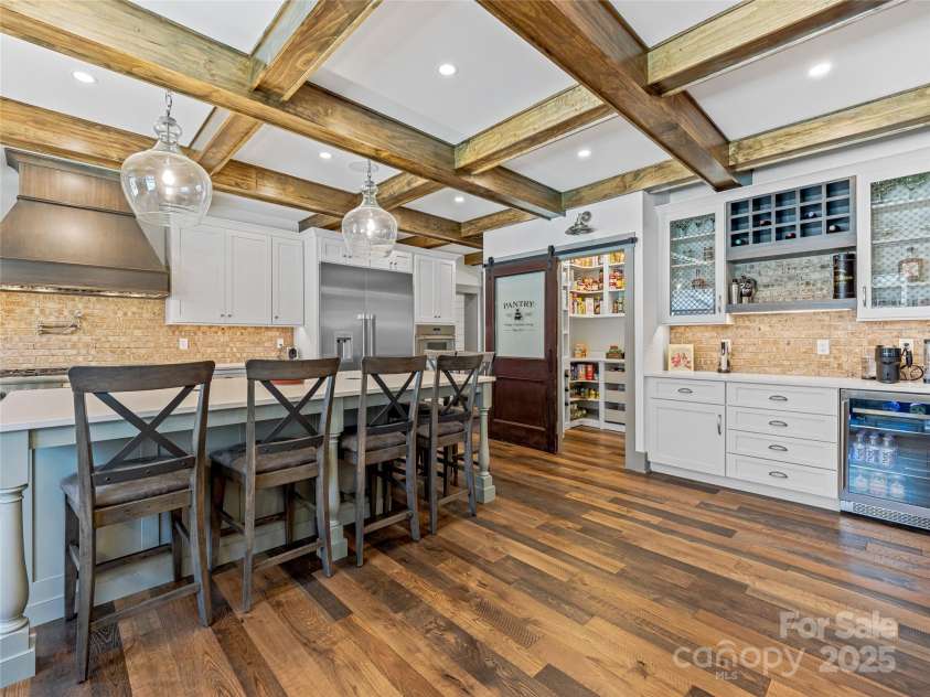 59 Bradford Hill Road, Mills River, NC 28759.  MLS# CAR4241459, YatesRealty ID 16892. Kitchen w/ coffered ceiling, walk-in pantry, and bar