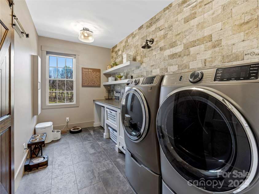 59 Bradford Hill Road, Mills River, NC 28759.  MLS# CAR4241459, YatesRealty ID 16892. Laundry room w/ sink and laundry chute