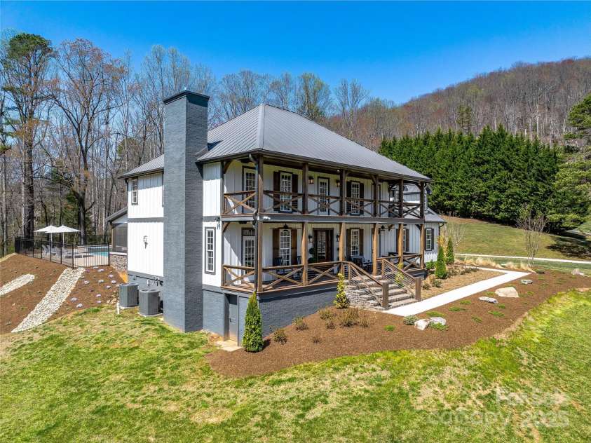 59 Bradford Hill Road, Mills River, NC 28759.  MLS# CAR4241459, YatesRealty ID 16892. Stunning 4-br/3.5-ba luxury farmhouse w/ pool on 5.5 acres
