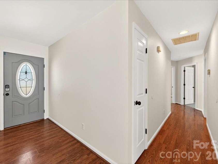 3002 Plyler Mill Road, Monroe, NC 28112.  MLS# CAR4330579, YatesRealty ID 16894. Hallway and front door