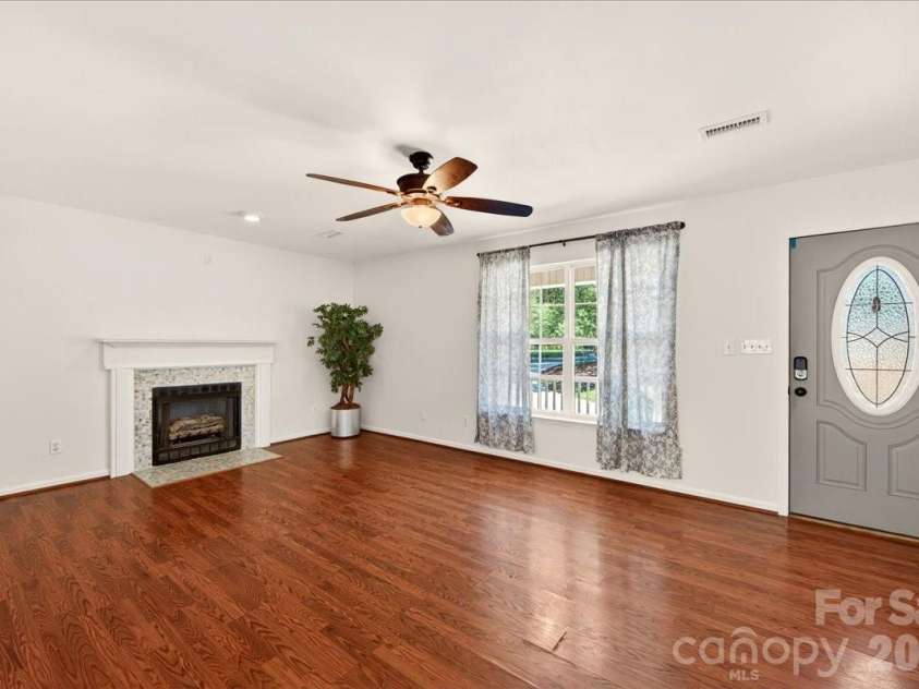 3002 Plyler Mill Road, Monroe, NC 28112.  MLS# CAR4330579, YatesRealty ID 16894. Living room