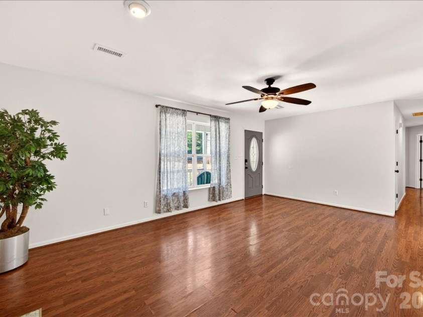 3002 Plyler Mill Road, Monroe, NC 28112.  MLS# CAR4330579, YatesRealty ID 16894. Living room