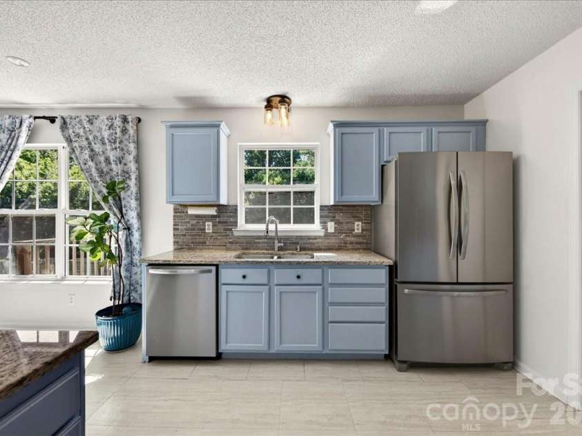 3002 Plyler Mill Road, Monroe, NC 28112.  MLS# CAR4330579, YatesRealty ID 16894. Open and bright kitchen