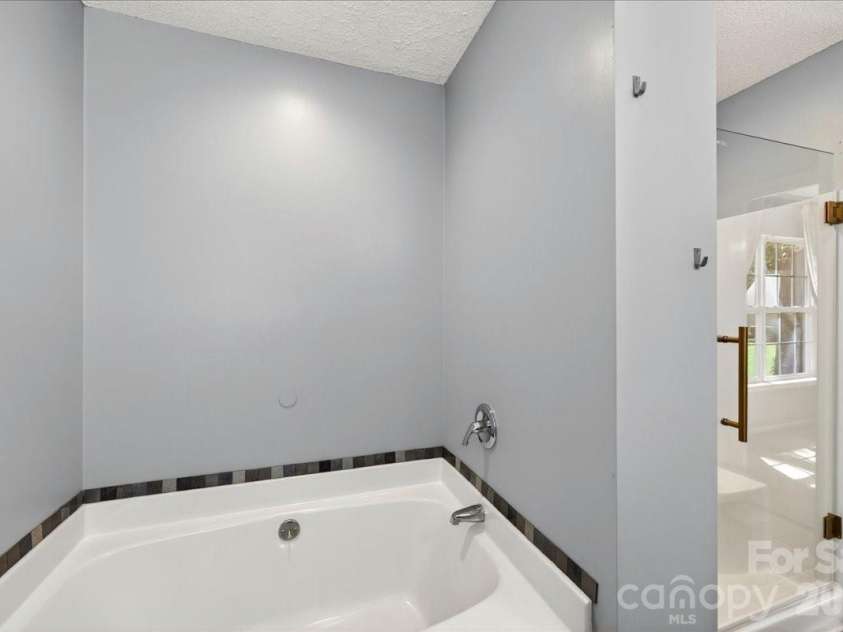 3002 Plyler Mill Road, Monroe, NC 28112.  MLS# CAR4330579, YatesRealty ID 16894. Primary en suite with garden tub
