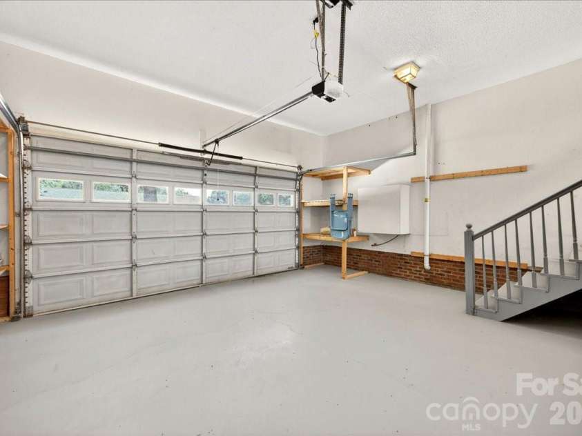 3002 Plyler Mill Road, Monroe, NC 28112.  MLS# CAR4330579, YatesRealty ID 16894. Two car garage with storage