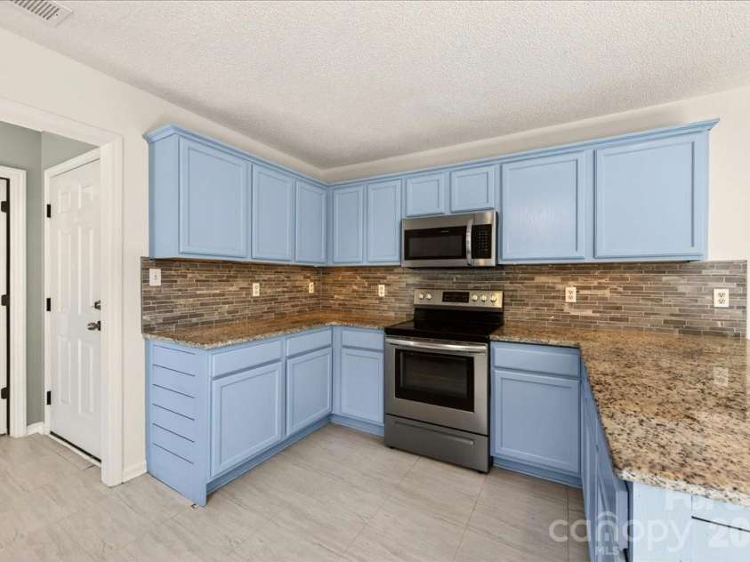 3002 Plyler Mill Road, Monroe, NC 28112.  MLS# CAR4330579, YatesRealty ID 16894. Under cabinet lighting