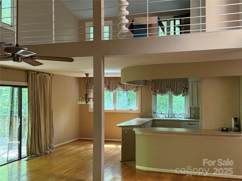 1451 Blueberry Lane, Charlotte, NC 28226.  MLS# CAR4258872, YatesRealty ID 16895. 2 Story great room towards dining area & Kitchen. Room above is flex room/office . It could be finished into a 3rd bedroom