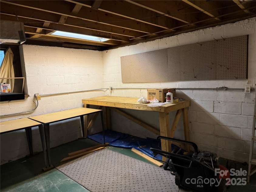 1451 Blueberry Lane, Charlotte, NC 28226.  MLS# CAR4258872, YatesRealty ID 16895. Basement-workshop/storage area