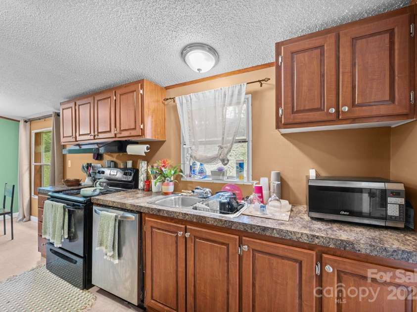 112 Cordella Road, Candler, NC 28715.  MLS# CAR4264603, YatesRealty ID 16904. 