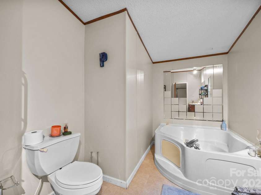 112 Cordella Road, Candler, NC 28715.  MLS# CAR4264603, YatesRealty ID 16904. Primary Bathroom