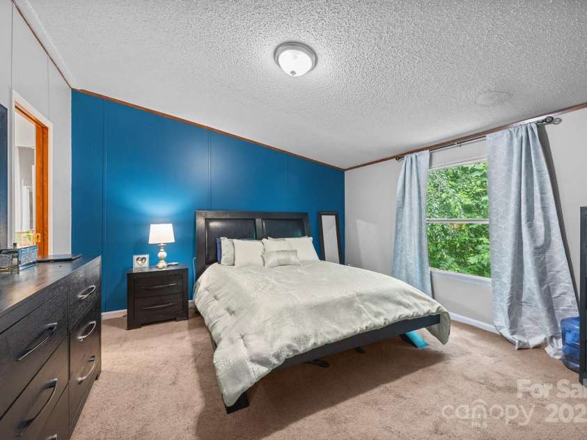 112 Cordella Road, Candler, NC 28715.  MLS# CAR4264603, YatesRealty ID 16904. Primary Bedroom