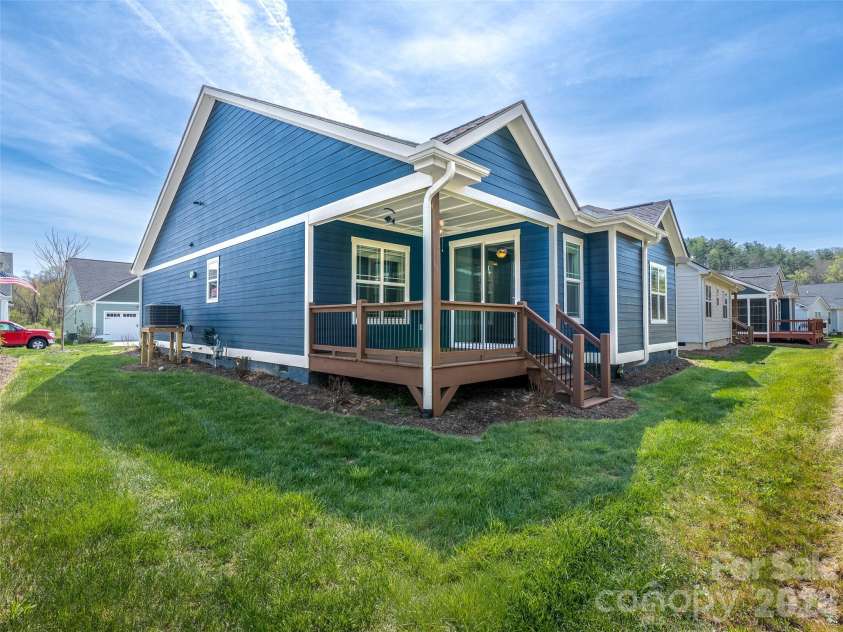 237 Leyland Circle, Hendersonville, NC 28792.  MLS# CAR4367023, YatesRealty ID 16905. Back yard and covered back deck.