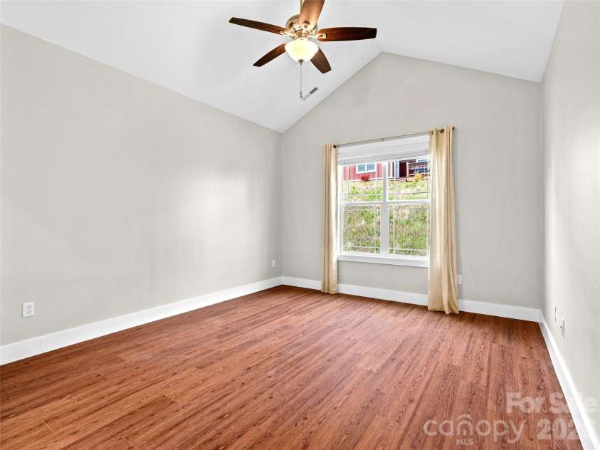 237 Leyland Circle, Hendersonville, NC 28792.  MLS# CAR4367023, YatesRealty ID 16905. Primary bedroom with vaulted ceilings.