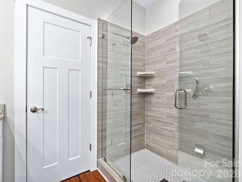 237 Leyland Circle, Hendersonville, NC 28792.  MLS# CAR4367023, YatesRealty ID 16905. Tiled shower in primary bathroom.