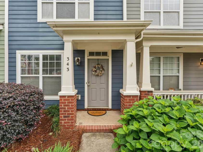 343 Hurston Circle, Charlotte, NC 28208.  MLS# CAR4353633, YatesRealty ID 16906. Covered front porch, HOA landscaped front yard, and mature hydrangea 