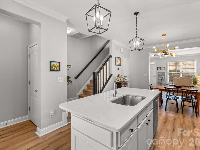343 Hurston Circle, Charlotte, NC 28208.  MLS# CAR4353633, YatesRealty ID 16906. Kitchen island with space for chairs, kitchen pantry to the left
