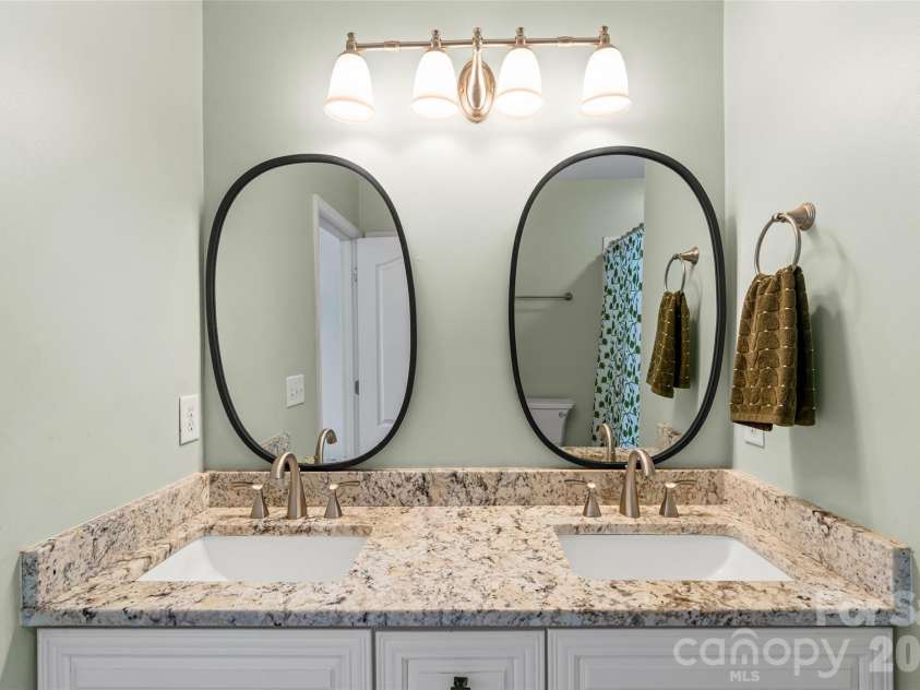 343 Hurston Circle, Charlotte, NC 28208.  MLS# CAR4353633, YatesRealty ID 16906. Primary bathroom, new double vanity, mirrors, and fixtures