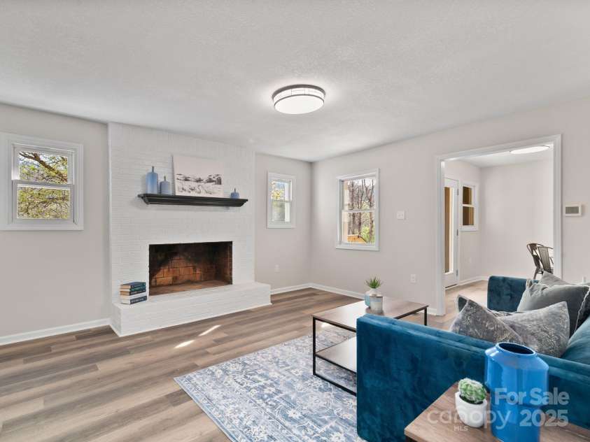 507 North Fork Road, Black Mountain, NC 28711.  MLS# CAR4243467, YatesRealty ID 16913. Living room with fireplace