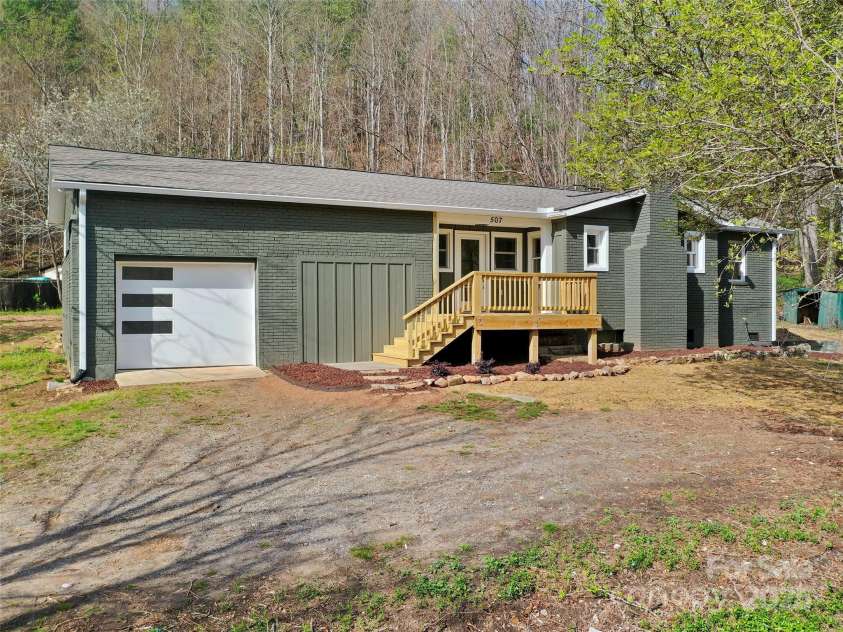 507 North Fork Road, Black Mountain, NC 28711.  MLS# CAR4243467, YatesRealty ID 16913. Unstaged photo Seller has seeded and placed straw in the yard.