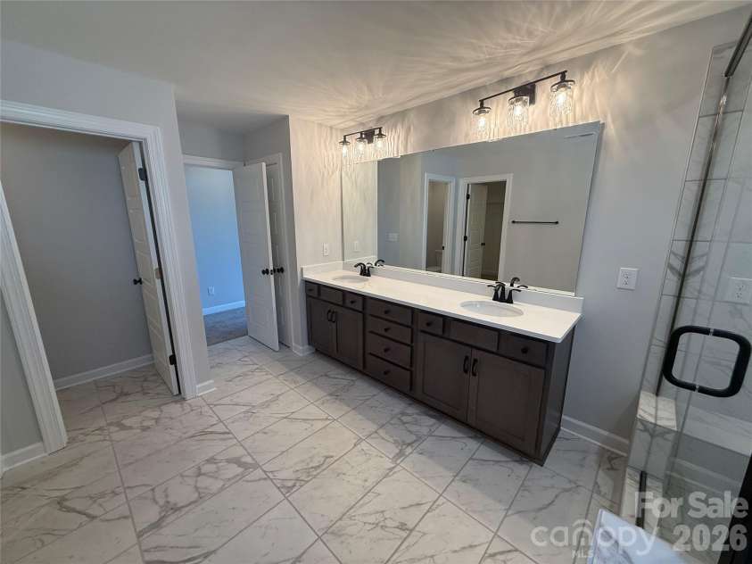 4048 Zinnia Drive, Harrisburg, NC 28075.  MLS# CAR4299454, YatesRealty ID 1692. Premier Bath