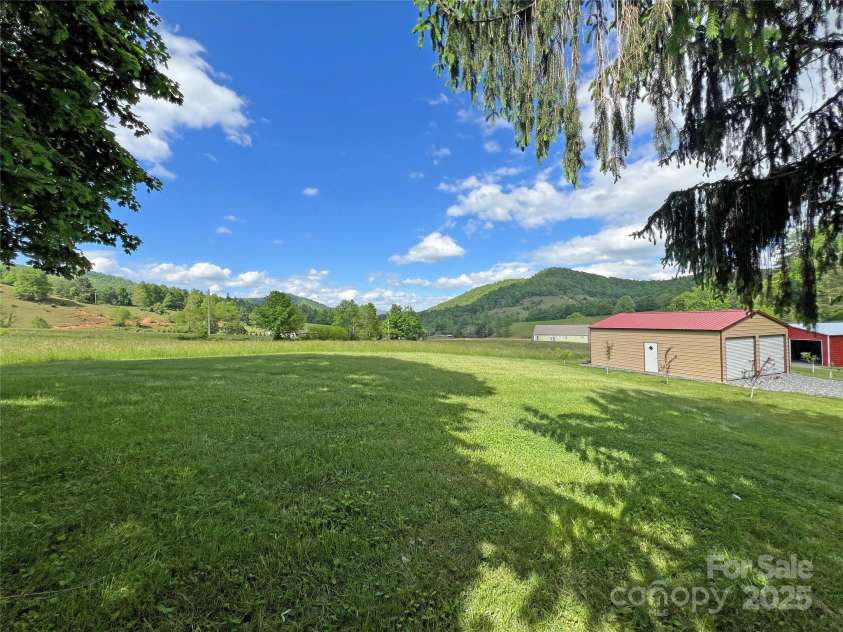 550 Joe Payne Road, Marshall, NC 28753.  MLS# CAR4257370, YatesRealty ID 16925. Garage and barn