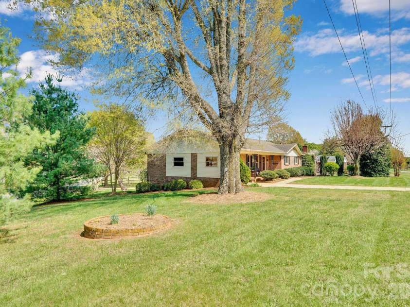 1411 Maiden Road, Maiden, NC 28650.  MLS# CAR4365271, YatesRealty ID 16933. Front Side yard-Corner Lot