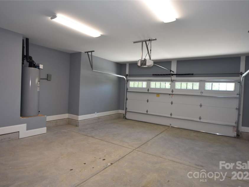 6519 Pargo Road, Charlotte, NC 28216.  MLS# CAR4246671, YatesRealty ID 16937. 2-car Garage. Water heater is located here as is the electrical panel.