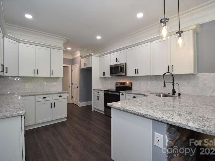 6519 Pargo Road, Charlotte, NC 28216.  MLS# CAR4246671, YatesRealty ID 16937. Beautiful floors and lighting!
