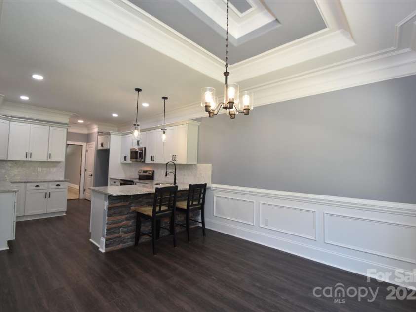 6519 Pargo Road, Charlotte, NC 28216.  MLS# CAR4246671, YatesRealty ID 16937. Kitchen Bar with seating area at bar
