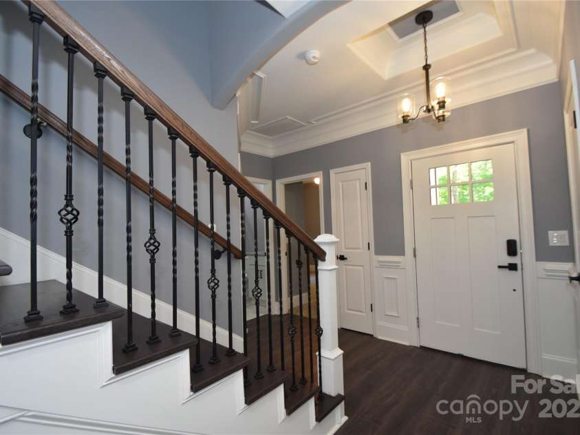 6519 Pargo Road, Charlotte, NC 28216.  MLS# CAR4246671, YatesRealty ID 16937. Looking toward open foyer area and front door of home.