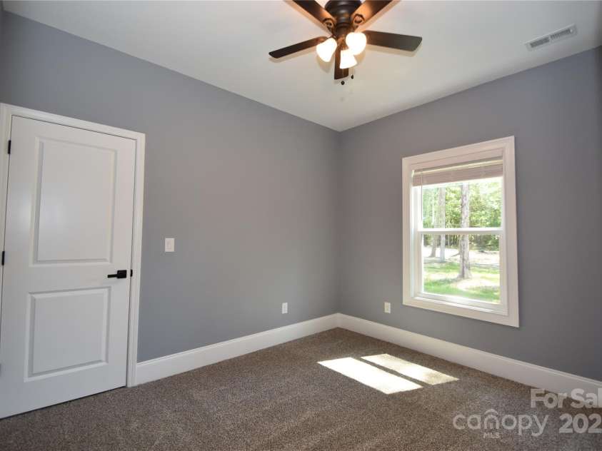 6519 Pargo Road, Charlotte, NC 28216.  MLS# CAR4246671, YatesRealty ID 16937. Main Level Secondary Bedroom.