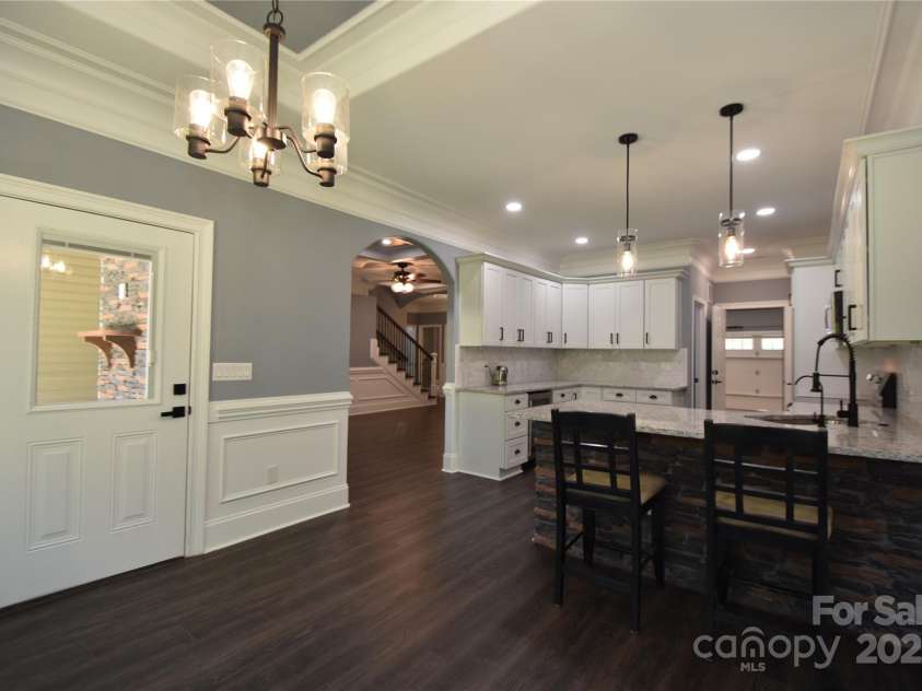6519 Pargo Road, Charlotte, NC 28216.  MLS# CAR4246671, YatesRealty ID 16937. View of Kitchen from the Dining. Door to rear patio.