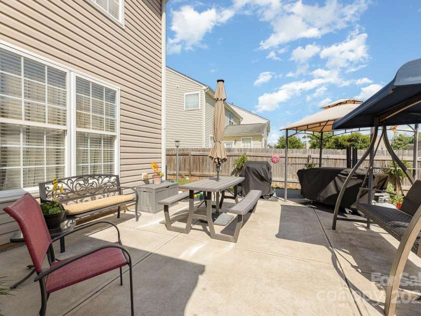 411 Summergate Drive, Winston Salem, NC 27103.  MLS# CAR4264420, YatesRealty ID 16942. Oversized paved patio ensures there is room for all the outdoor furniture & minimizes upkeep.