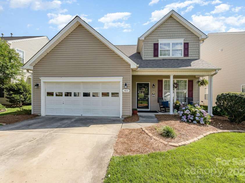 411 Summergate Drive, Winston Salem, NC 27103.  MLS# CAR4264420, YatesRealty ID 16942. Rocking Chair front porch for morning coffee or to unwind after a long day.