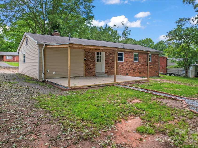 2401 Woodleaf Drive, Gastonia, NC 28052.  MLS# CAR4257882, YatesRealty ID 16943. Back patio with covered area