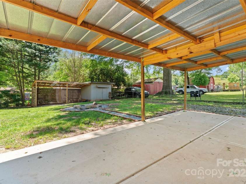 2401 Woodleaf Drive, Gastonia, NC 28052.  MLS# CAR4257882, YatesRealty ID 16943. Covered back patio