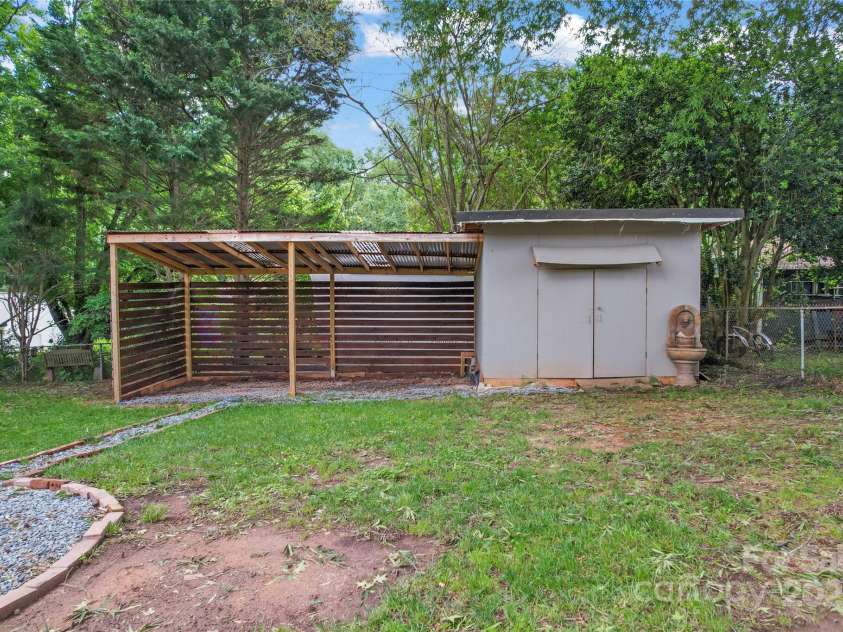 2401 Woodleaf Drive, Gastonia, NC 28052.  MLS# CAR4257882, YatesRealty ID 16943. Shed and covered are in fenced yard and fire pit