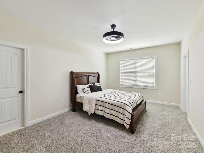 873 Penny Royal Avenue, Fort Mill, SC 29715.  MLS# CAR4234425, YatesRealty ID 16944. Bedroom 3 has Closet, Fan and access to Large Storage Room